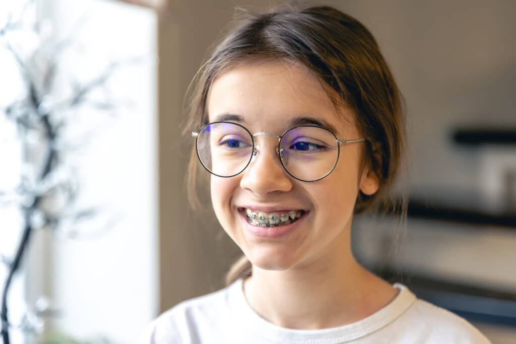 portrait-teenage-girl-with-glasses-braces